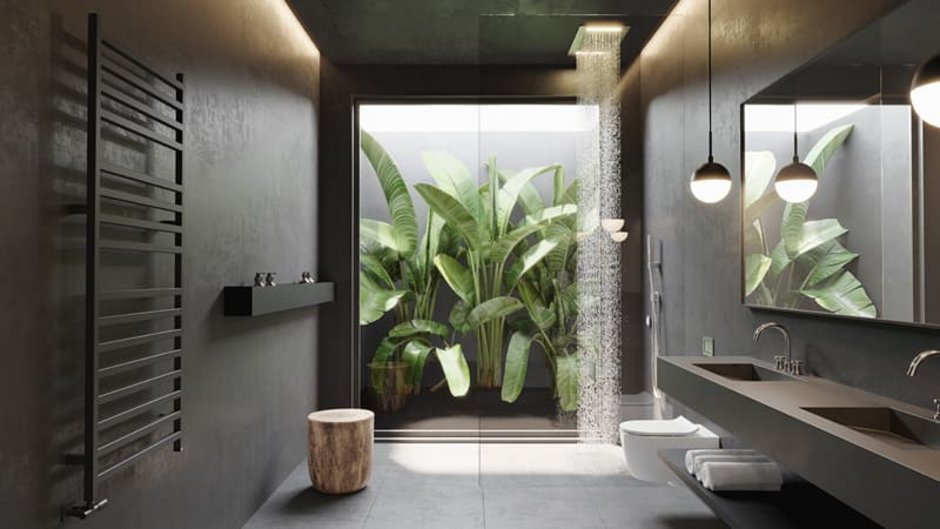 Sichtbeton, dunkelgraues Badezimmer mit großem Fenster zu einem bepflanzten Atrium. Foto: Michael / stock.adobe.com